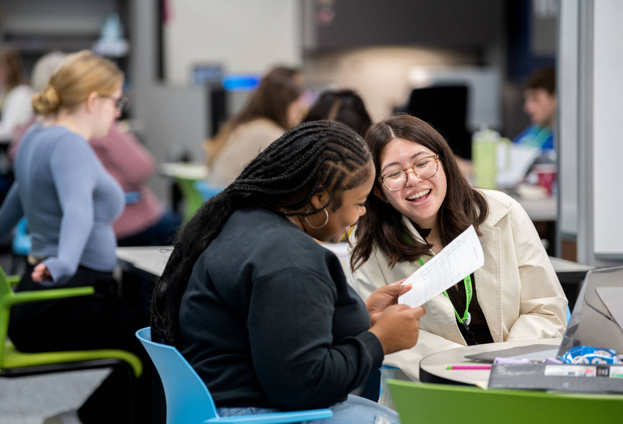 Students in the writing center working on a paper.